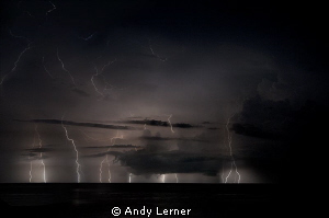 Multiple exposure of a storm over the waters near Amed Bali. by Andy Lerner 